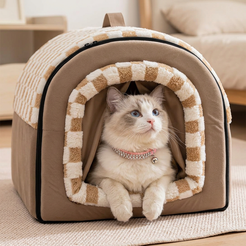 Ragdoll wearing pink crystal collar in checkered pet house close-up
