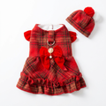 Red tartan dress positioned straight on white with its matching hat showing both red and white pom-poms