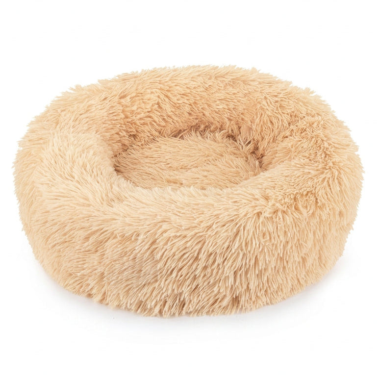 A round, fluffy faux-fur pet bed in a light tan or beige color, shown on a clean white background.