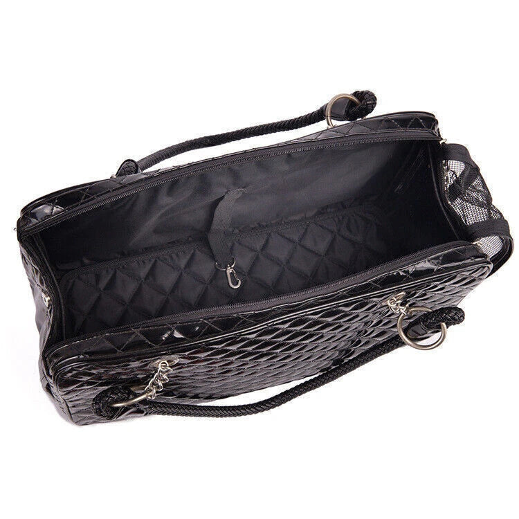 Black quilted pet carrier with a textured pattern on a white background