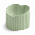 Sage green ceramic heart-shaped pet bowl with ribbed exterior, white background
