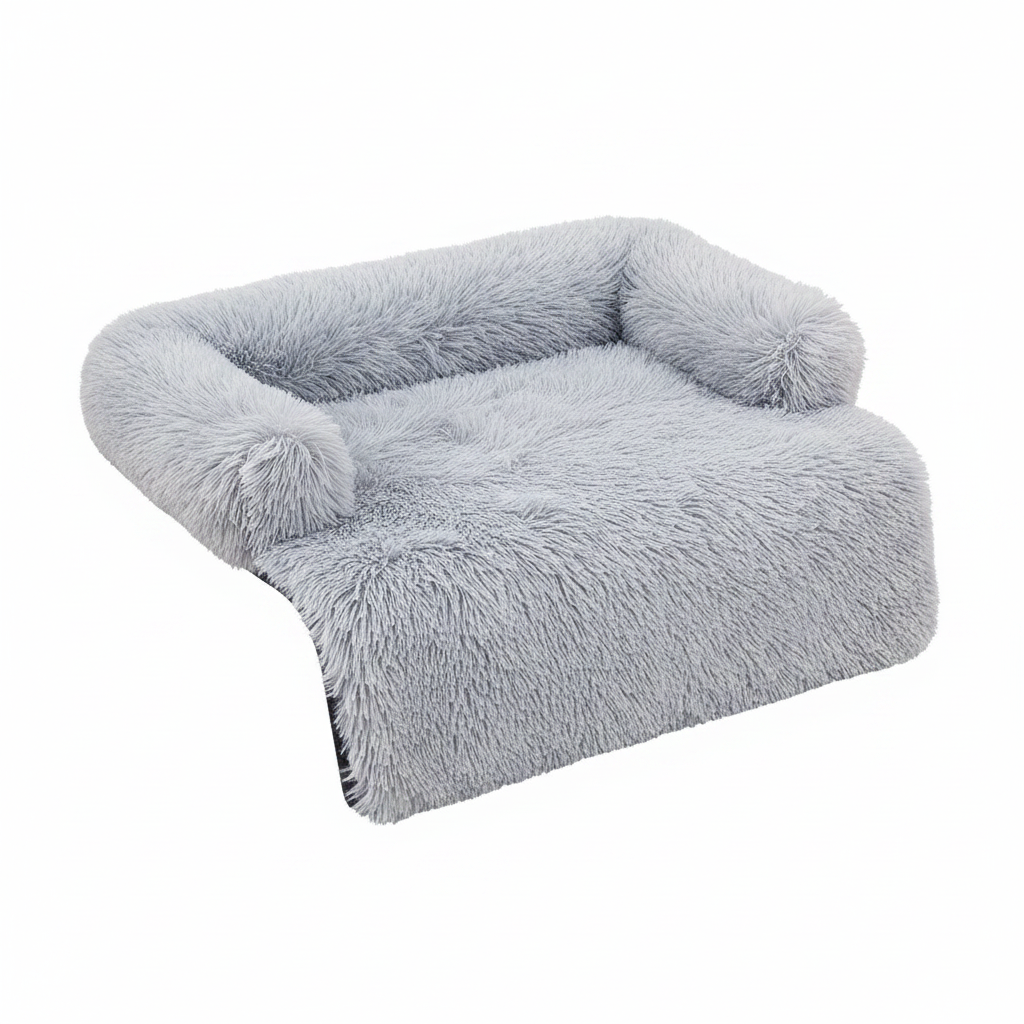 Icy silver grey long shaggy faux fur sofa cover protector with raised bolster back and sides and a flat front drape panel, shown at a 3/4 angle on a white background