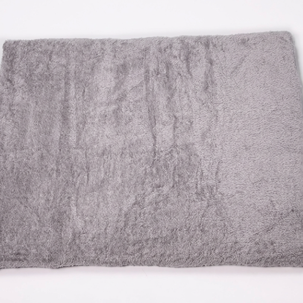 Square image of the pet mat’s plain gray reverse side
