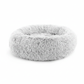 Light grey round donut pet bed with long shaggy faux fur and a deep cushioned center, shown at a slight angle on a white background