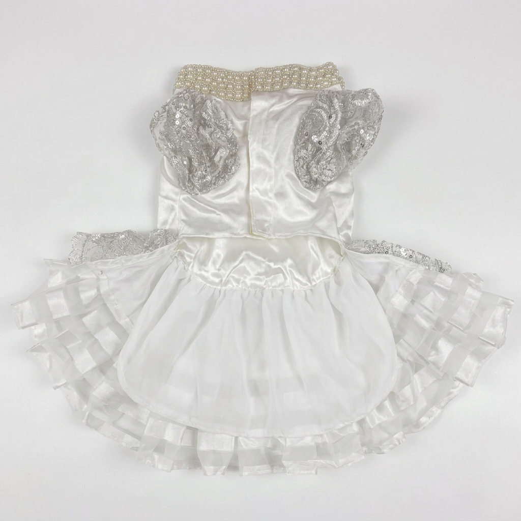 Straightened underside view of the dress laid flat on white