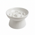 White ceramic raised slow feeder cat bowl with ribbed pedestal base and heart-center ridge pattern, white background