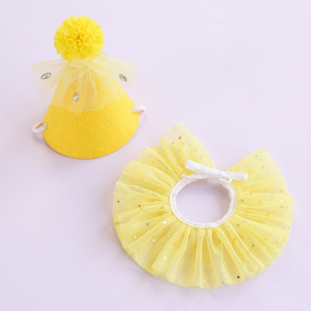 Yellow party set on a very light lavender square background